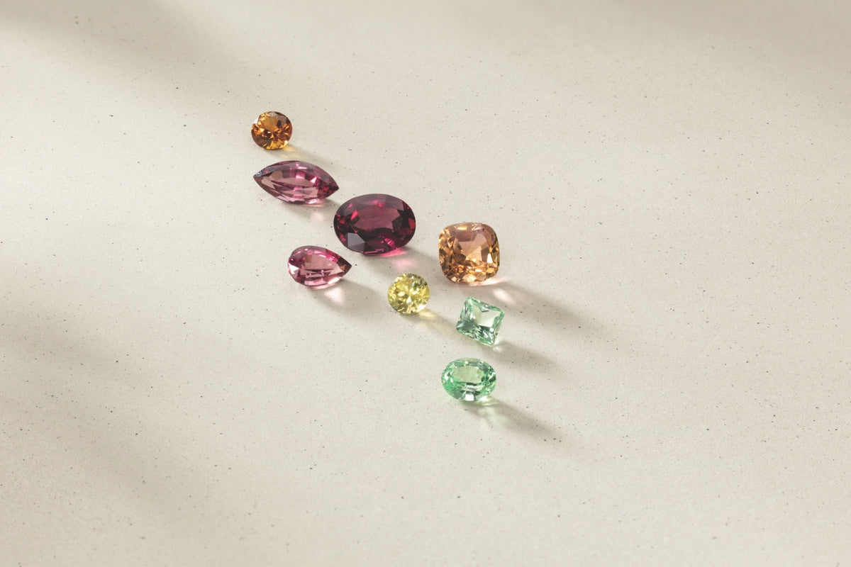Colored Gemstones on Cream Background Can I Choose a Lab-Grown Colored Gemstone for an Engagement Ring?