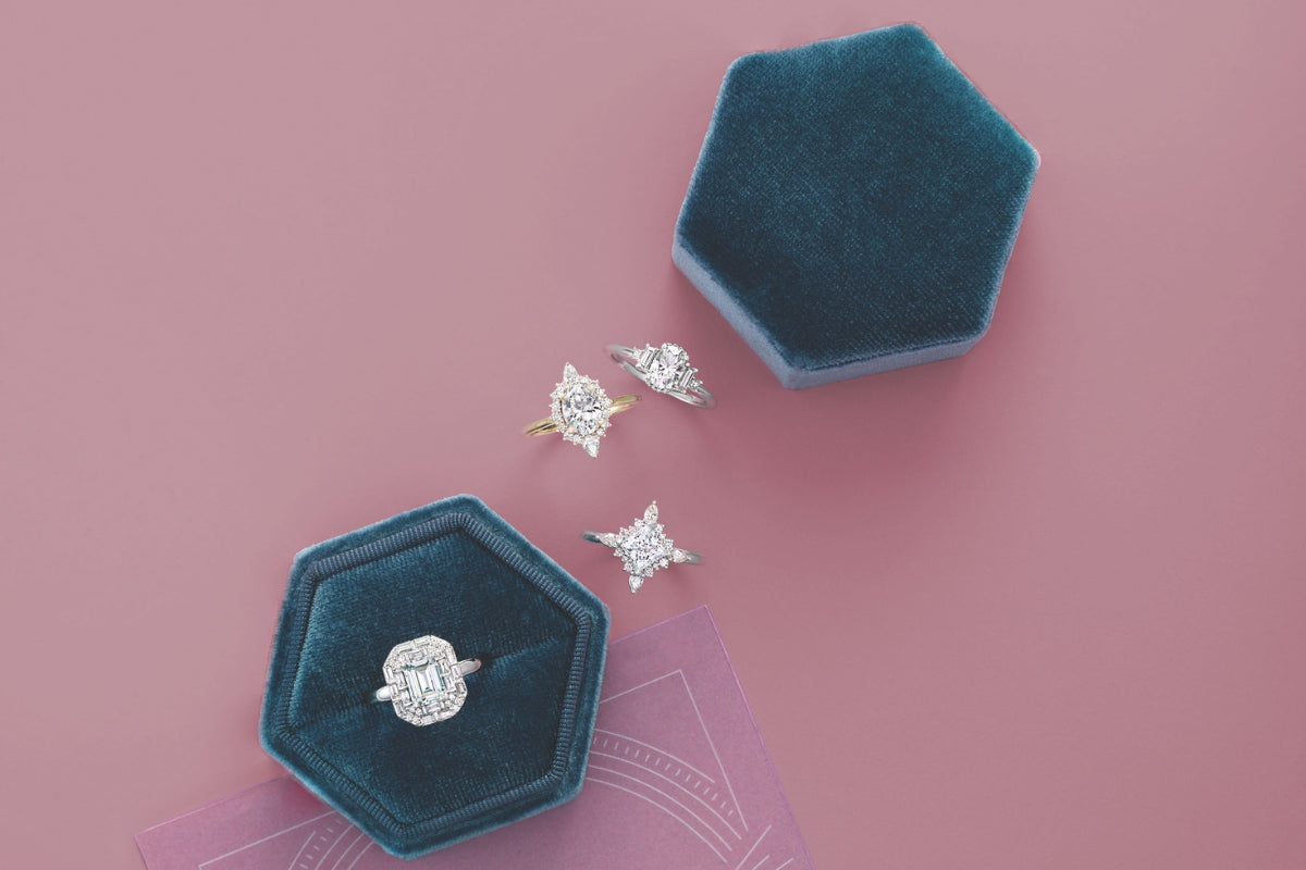 Lab-Grown Diamond Engagement Rings on pink background in blue velvet boxes Soha Diamond Co. Madison, Wisconsin