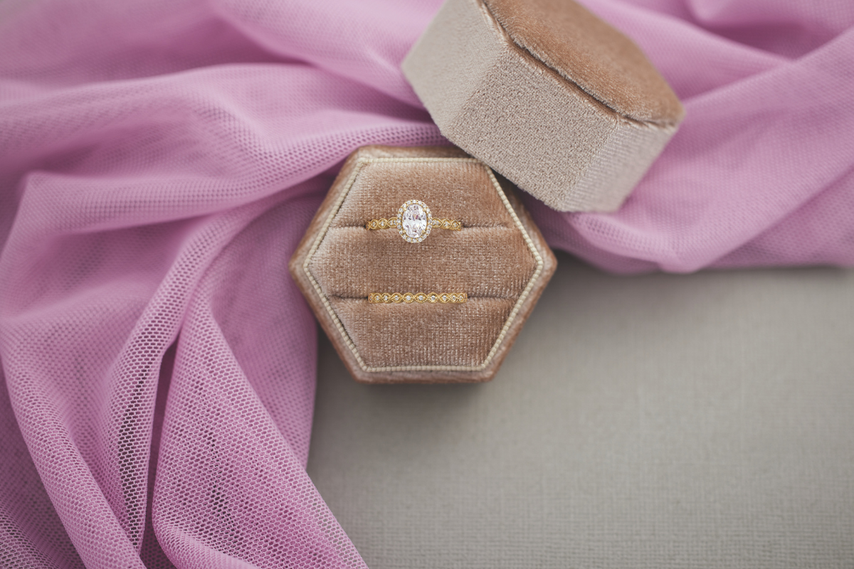 engagement ring and wedding band in ring box - blog post by Soha Diamond Co. Jewelry Store in Madison, WI