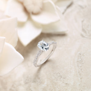 Infinity Inspired engagement ring with oval diamond