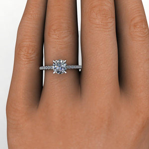 solitaire engagement ring with side stones and diamond collar 