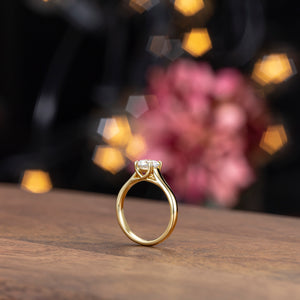 Yellow gold cathedral style solitaire
