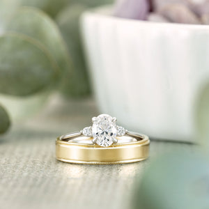 Three-Stone Ring paired with yellow gold wedding band