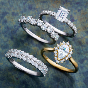 Halo engagement ring pear diamond yellow gold