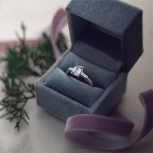 Three stone emerald cut tapered baguette ring in bbox