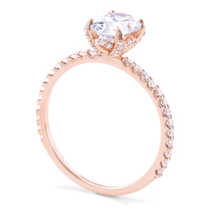 Rose gold oval engagement ring with diamonds on prongs