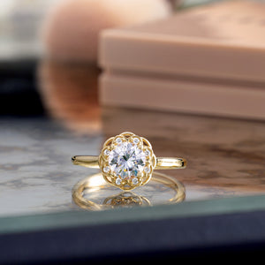 vintage inspired scrollwork engagement ring on table