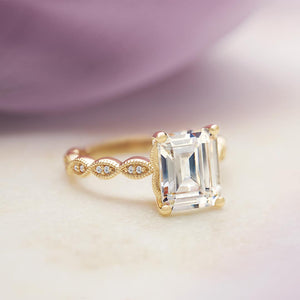 Vintage inspired scalloped engagement ring with emerald cut stone
