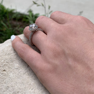 Halo engagement ring with pave diamonds on all sides