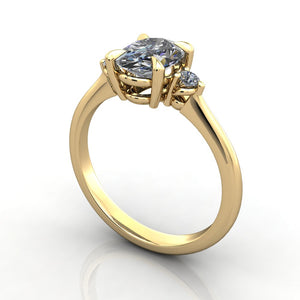 Petite three stone engagement ring yellow gold