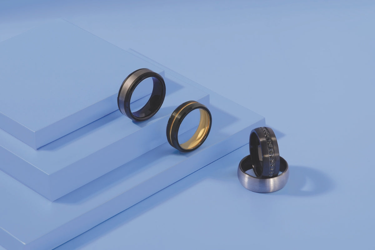Black Wedding Bands For Men Blog Rings on Blue Background by Soha Diamond Co. in Fitchburg, Wisconsin