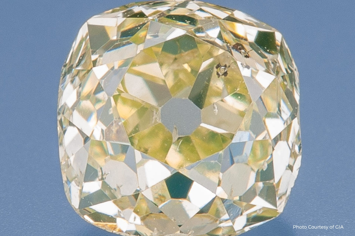 Soha Diamond Co. Yellow Natural Cushion Diamond On Blue Background Old Mine Cut vs. Old European Cut Diamonds: Vintage Engagement Rings with Timeless Appeal in Madison, Wisconsin A Jeweler in Madison, Wisconsin