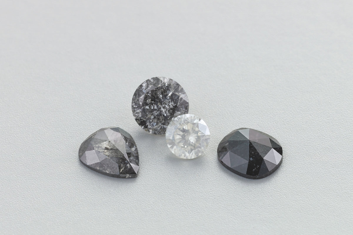 Soha Diamond Co. Salt and Pepper Diamonds on Gray Background Should I Choose a Salt and Pepper Diamond for My Engagement Ring? A Madison, Wisconsin Jeweler’s Guide to This Unique and Ethical Choice Jeweler in Madison, Wisconsin