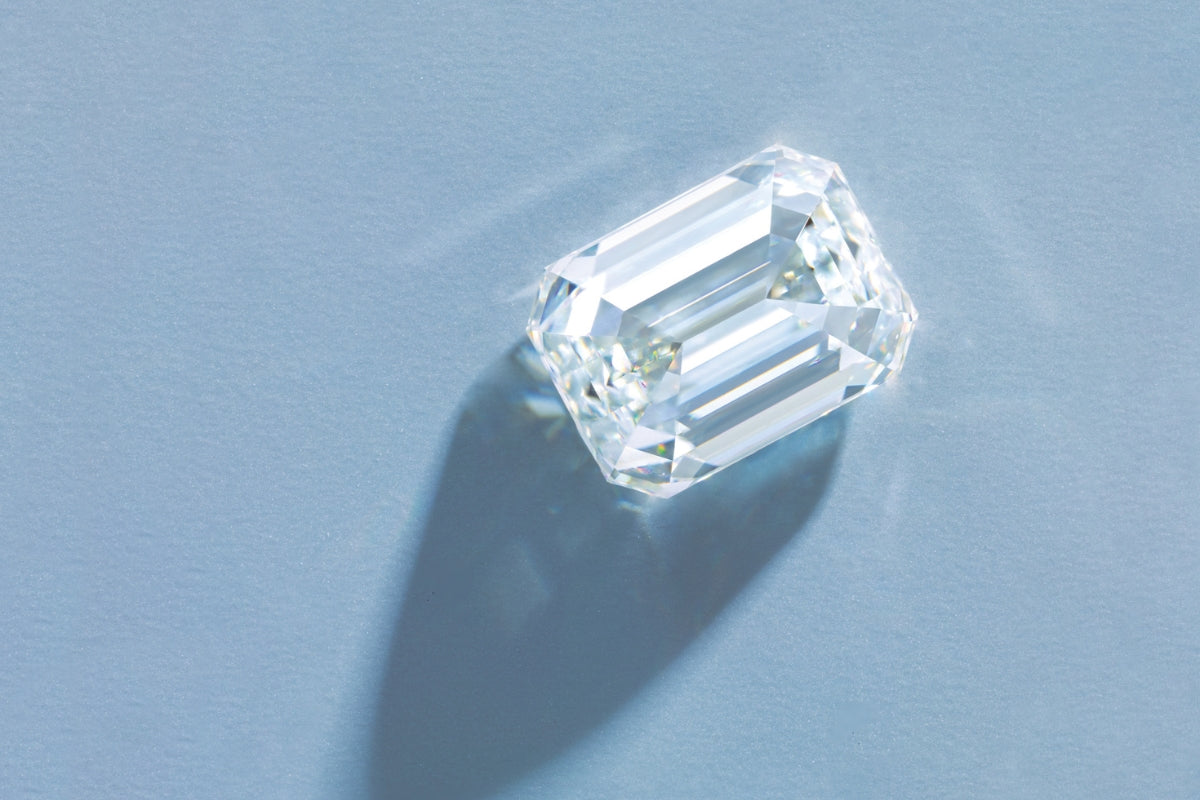 Blue Emerald Cut Loose Diamond on Blue Background What are Step-Cup Diamonds Blog Post Lab-Grown Diamond Engagement Rings by Soha Diamond Co.  in Madison, Wisconsin