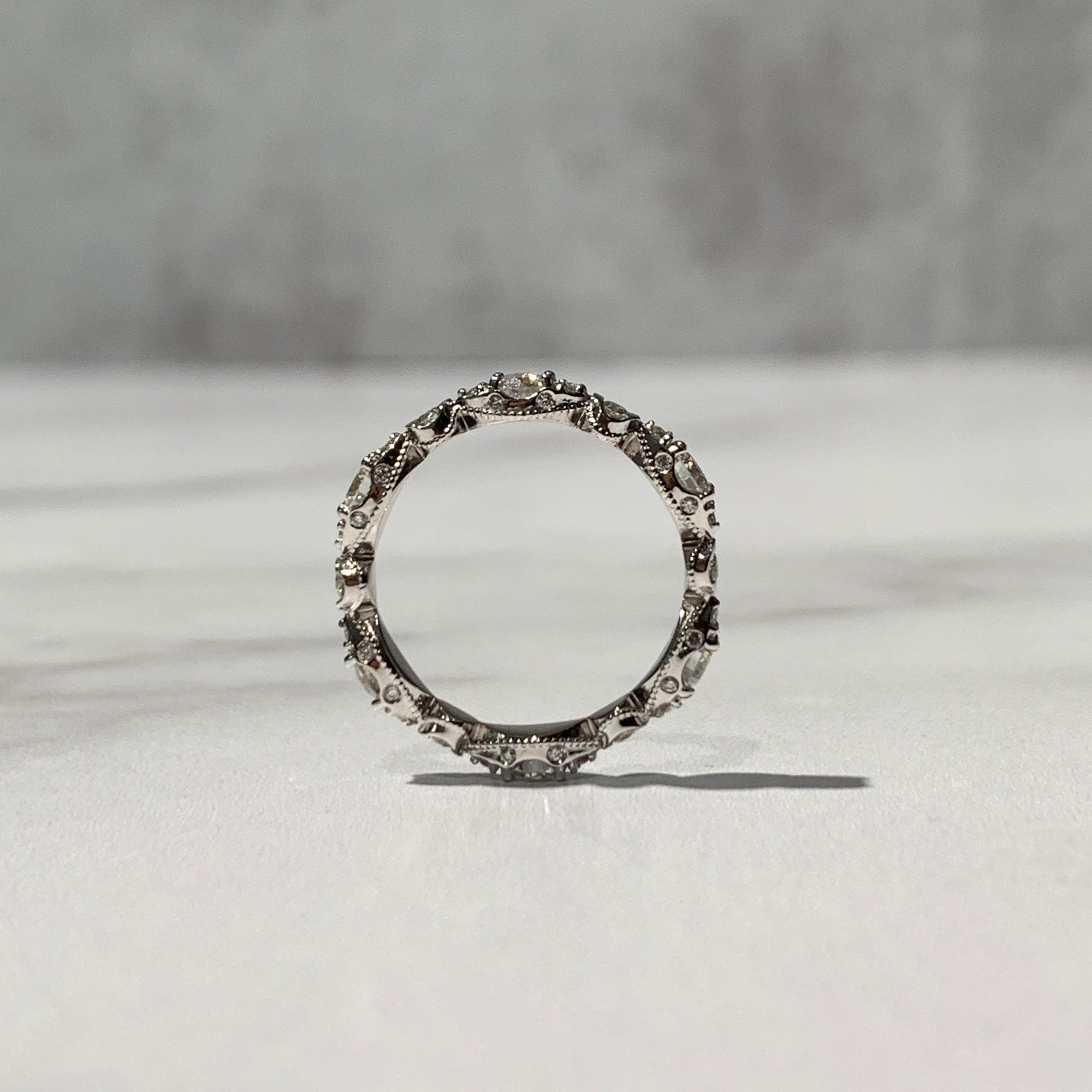 Vintage inspired eternity wedding band with beading and scrollwork