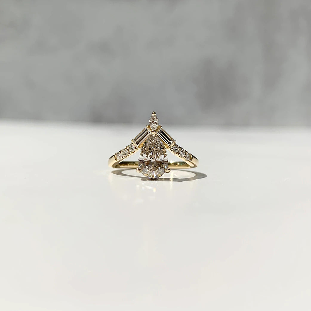 V-shaped pear diamond engagement ring in 14k yellow gold