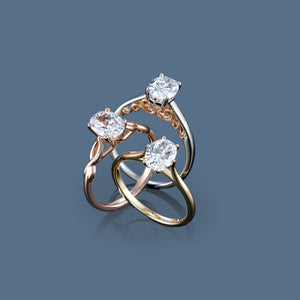 Infinity inspired engagement ring with oval diamond in rose gold