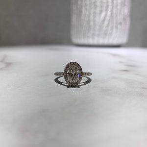 Classic oval diamond halo engagement ring