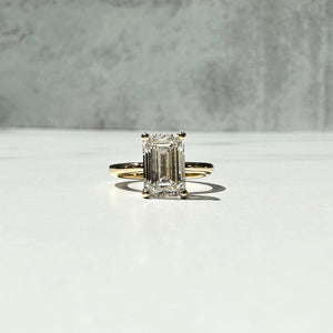 Solitaire engagement ring with emerald cut