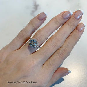 Two carat round diamond halo engagement ring