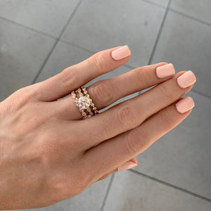 Rose gold solitaire engagement ring with scalloped band