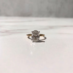 Two Tone oval solitaire engagement ring yellow gold and platinum