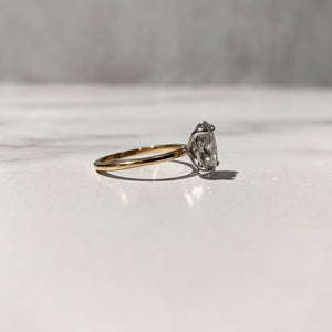 Two tone oval solitaire engagement ring
