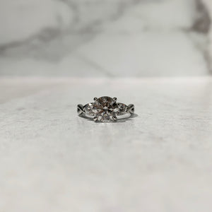 Three stone infinity inspired engagement ring in platinum