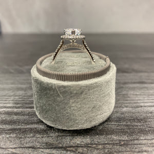 Pear halo engagement ring in ring box