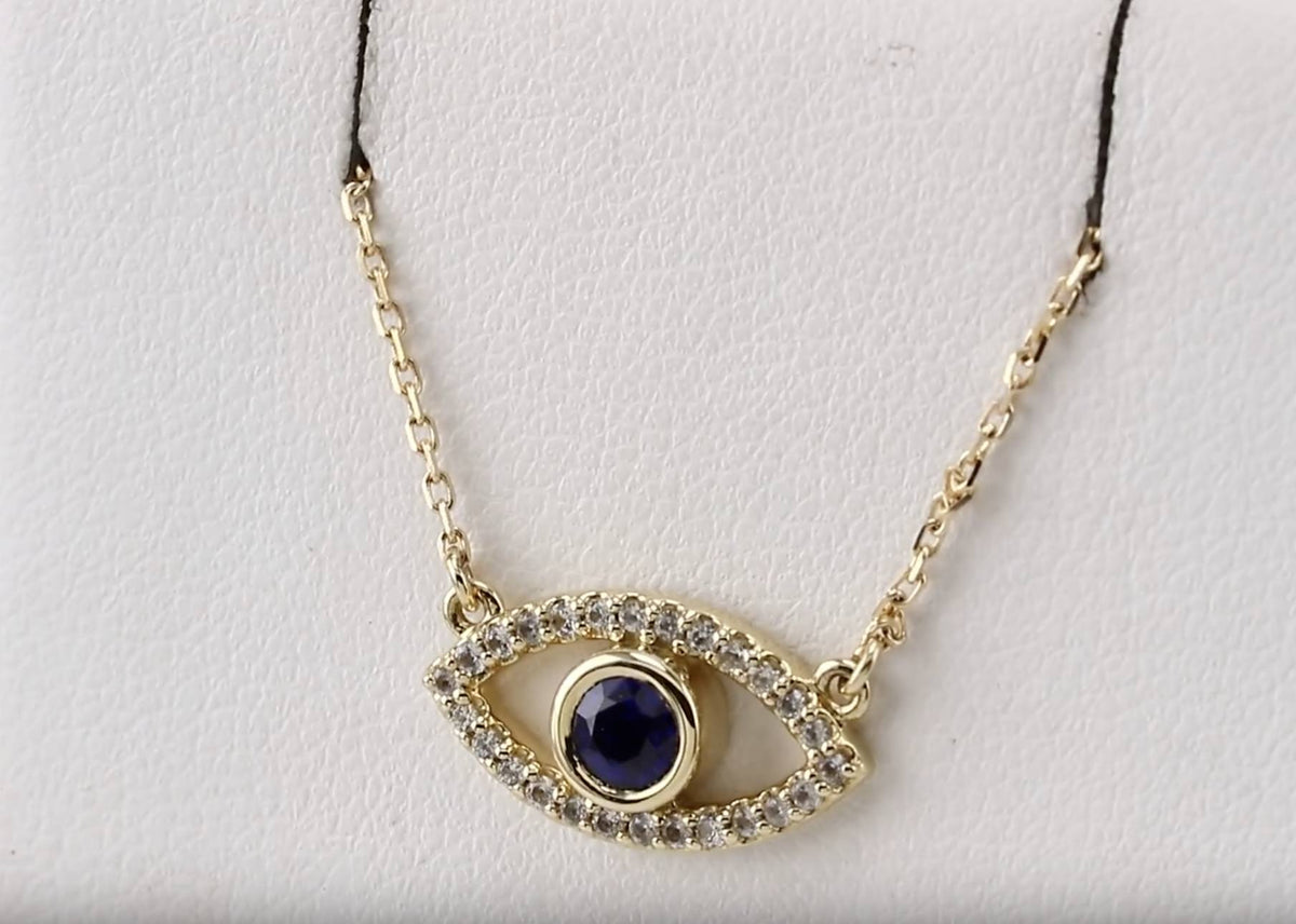 Evil Eye necklace in 14k yellow gold with blue sapphire and diamond