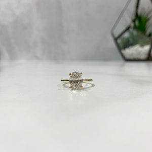 Oval solitaire engagement ring yellow gold