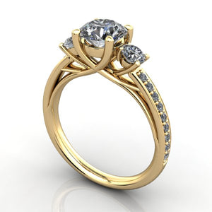 Three stone engagement ring yellow gold