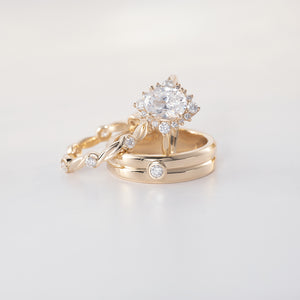 Halo engagement ring with oval diamond