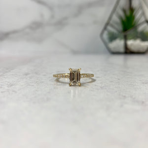 Yellow Gold solitaire ring with emerald cut diamond