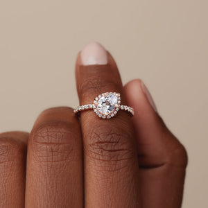 Tilted halo engagement ring rose gold on hand