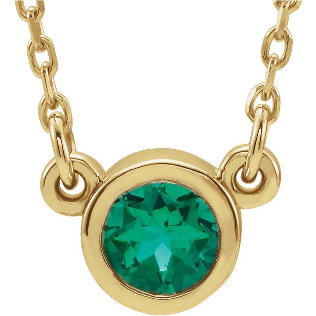emerald bezel set necklace yellow gold