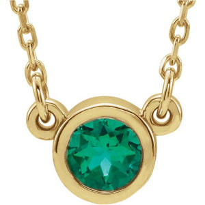 emerald bezel set necklace yellow gold