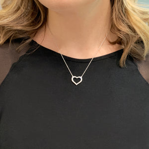 Heart shaped necklace on neck