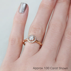 Rose gold halo on hand