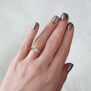 Rose gold halo engagement ring