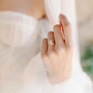 shield shaped oval halo ring on hand
