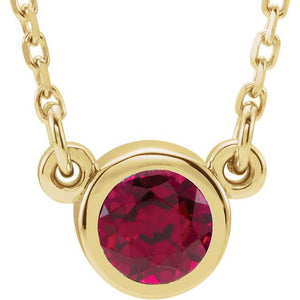 Ruby bezel set yellow gold necklace
