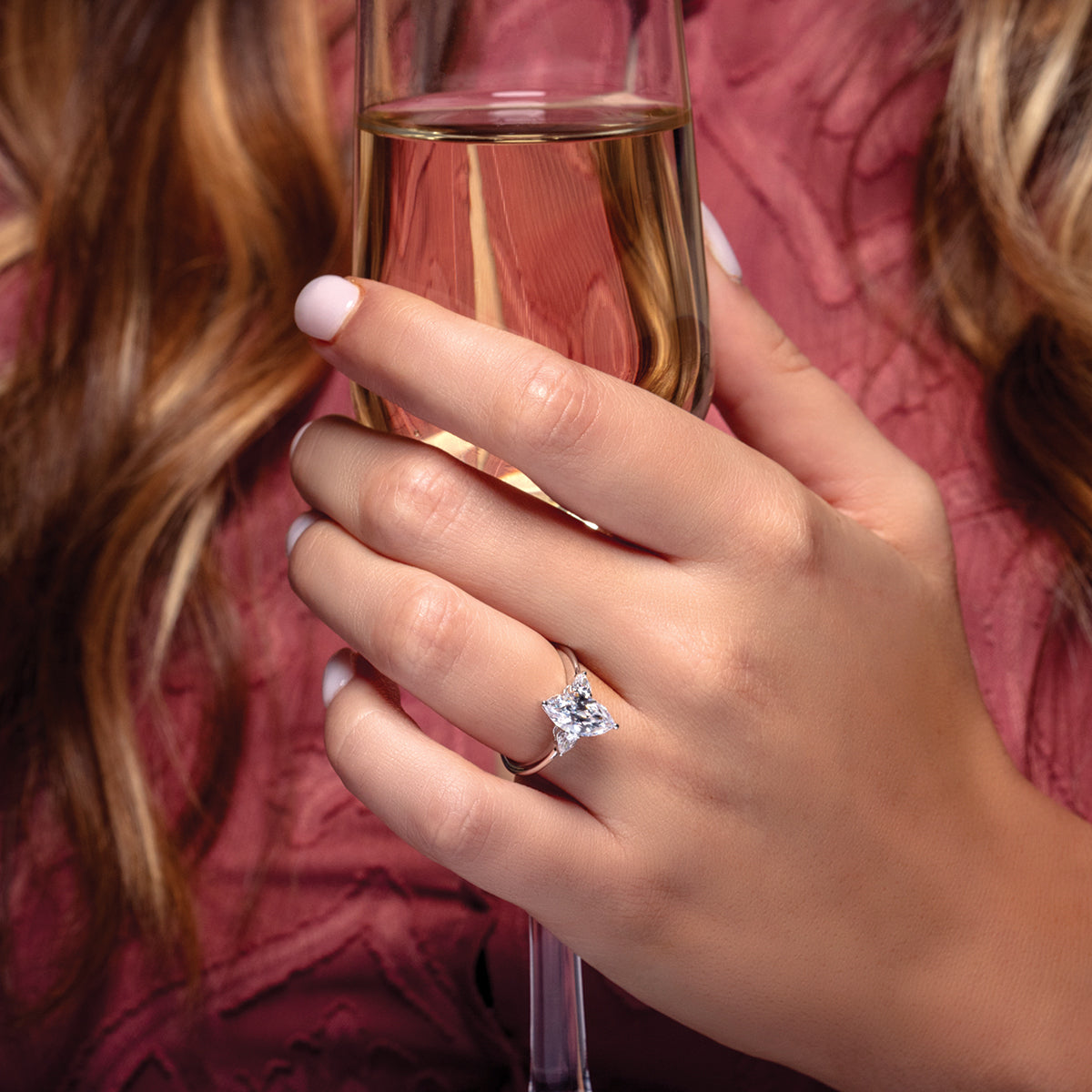 Three-Stone marquise engagement ring on hand