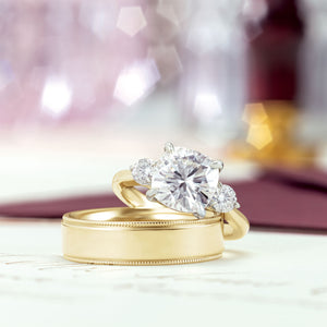 Two tone cushion cut engagement ring with yellow gold wedding band