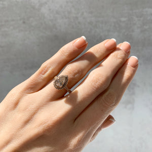 Bezel set pear infinity engagement ring